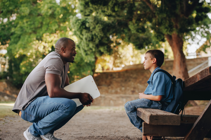 talking with young student