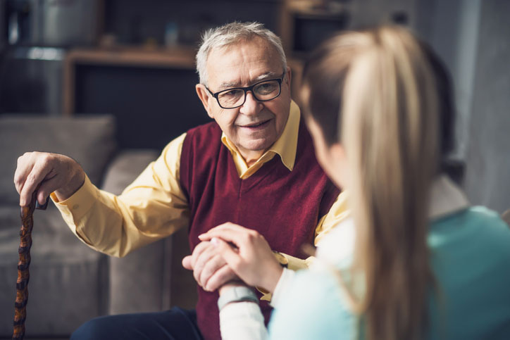 holding hand of elderly