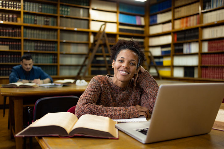 young woman studying in the library