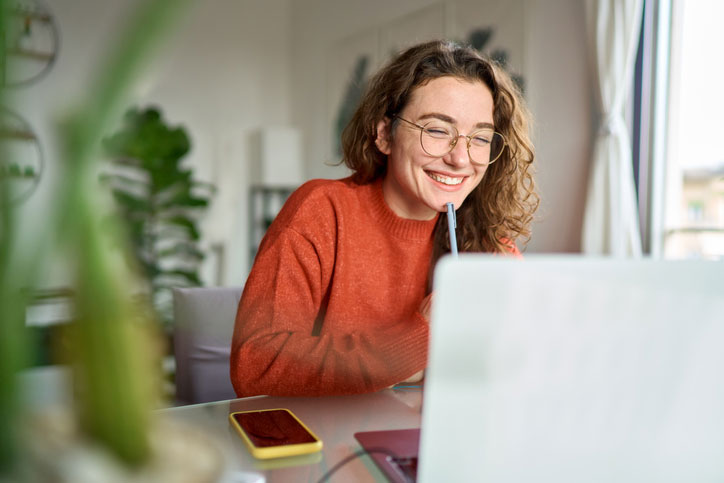 young happy student on computer