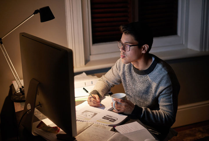 determined student hard at work on computer