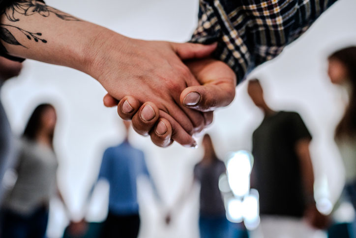 holding hands in group